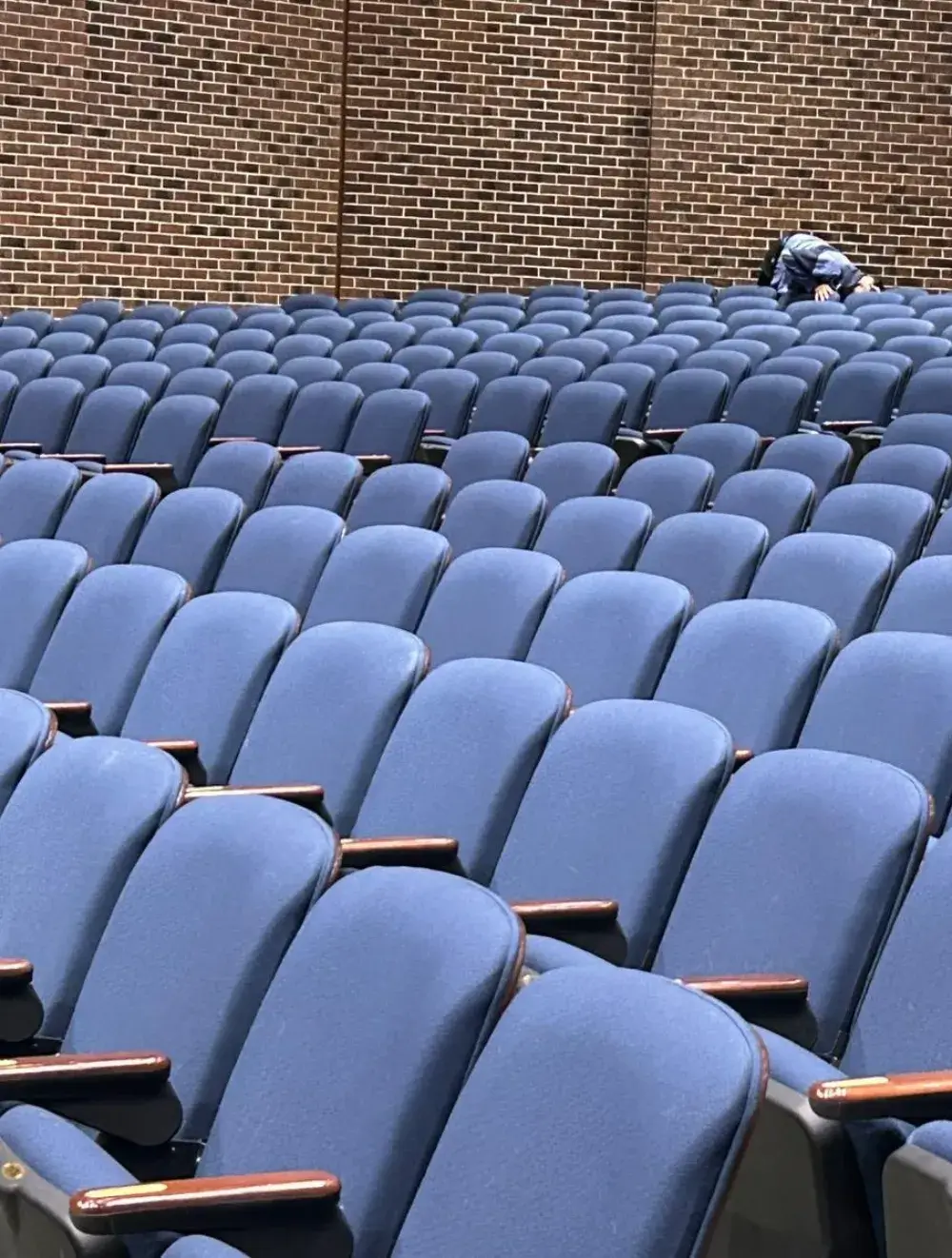 Janitorial staff performing commercial cleaning in Connecticut auditorium